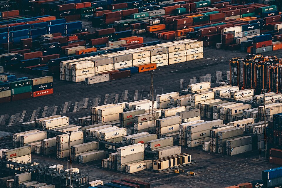 Aerial view of stacked shipping containers at a port