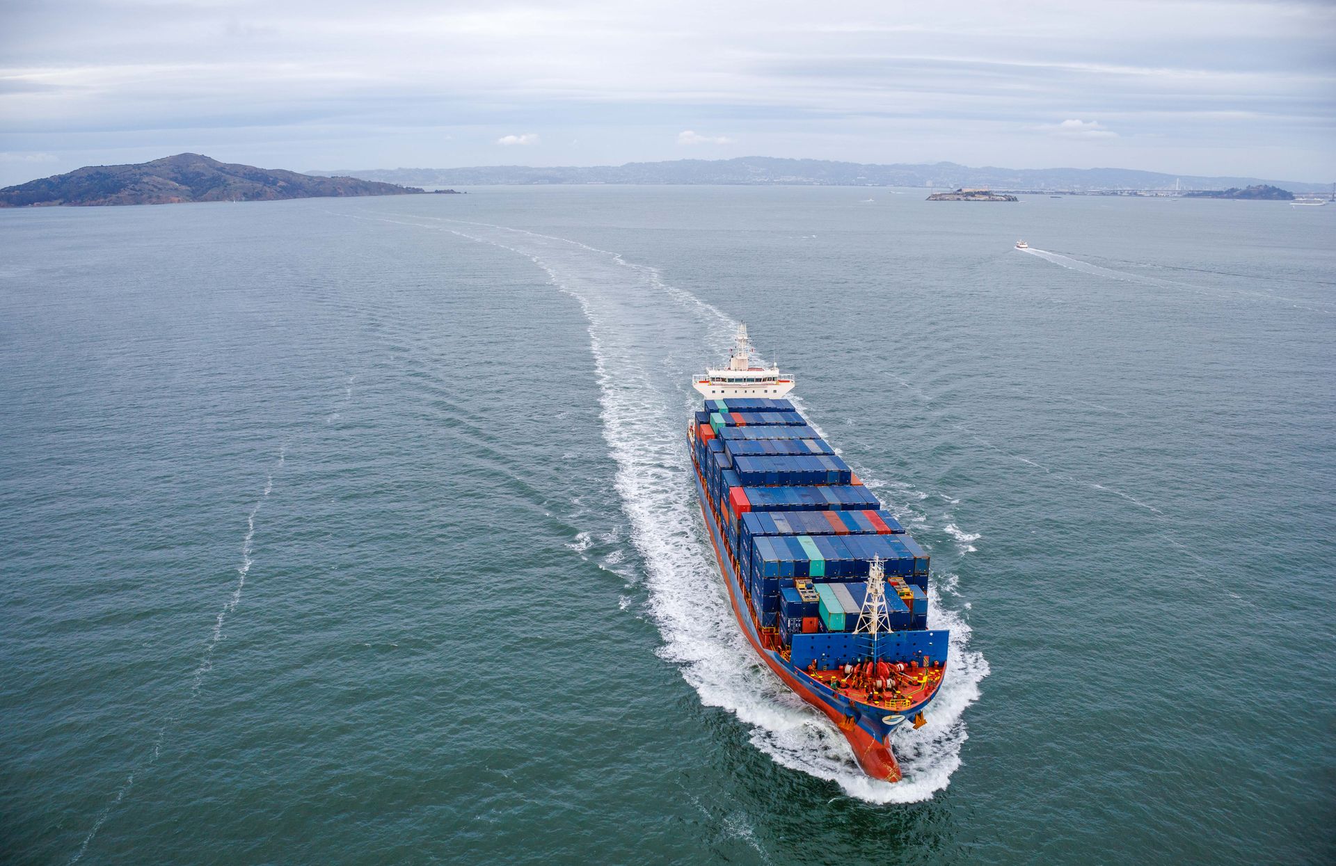 Aerial view of a loaded container ship at sea