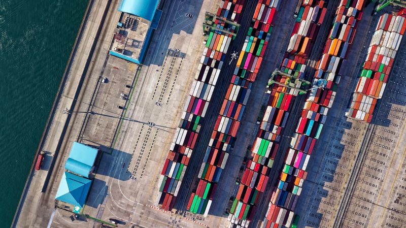 Aerial view of rows of shipping containers at a terminal